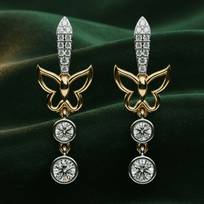 Planet Genesis - Gold butterfly earrings with diamond accents and two round dangling gemstones each, displayed on dark green velvet fabric. - IGI-Certified Lab-Grown Diamonds