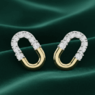 Planet Genesis - Crescent Duo Diamond Hoops on green fabric, elongated oval shape with diamond-set top half and smooth gold bottom in a modern design. - IGI-Certified Lab-Grown Diamonds