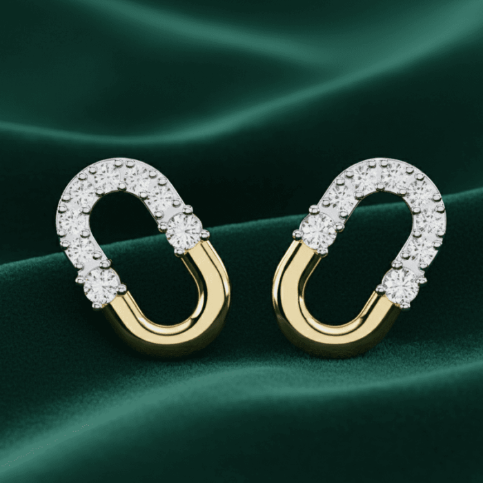 Planet Genesis - Crescent Duo Diamond Hoops on green fabric, elongated oval shape with diamond-set top half and smooth gold bottom in a modern design. - IGI-Certified Lab-Grown Diamonds Planet Genesis - Crescent Duo Diamond Hoops on green fabric, elongated oval shape with diamond-set top half and smooth gold bottom in a modern design. - IGI-Certified Lab-Grown Diamonds