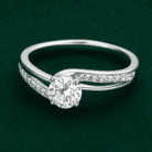 Planet Genesis - Diamond Solstice Halo Ring in white gold with round solitaire center diamond and pavé band, displayed on dark green textured background. - IGI-Certified Lab-Grown Diamonds