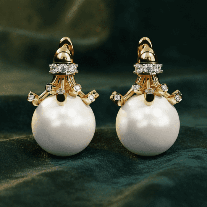 Planet Genesis - Pearl Crown Etoile Earrings with large white pearls, round diamonds, and polished gold settings on dark green velvet fabric. - IGI-Certified Lab-Grown Diamonds