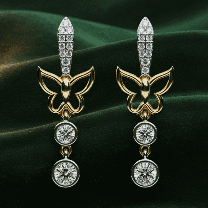 Planet Genesis - Gold butterfly earrings with diamond accents and two round dangling gemstones each, displayed on dark green velvet fabric. - IGI-Certified Lab-Grown Diamonds