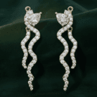 Planet Genesis - Twisting gold and diamond serpent earrings with pear-shaped and small diamonds on dark green background, elegant premium jewelry design. - IGI-Certified Lab-Grown Diamonds