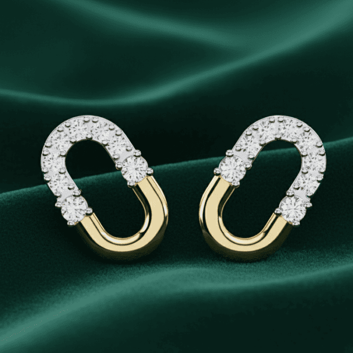 Planet Genesis - Crescent Duo Diamond Hoops on green fabric, elongated oval shape with diamond-set top half and smooth gold bottom in a modern design. - IGI-Certified Lab-Grown Diamonds